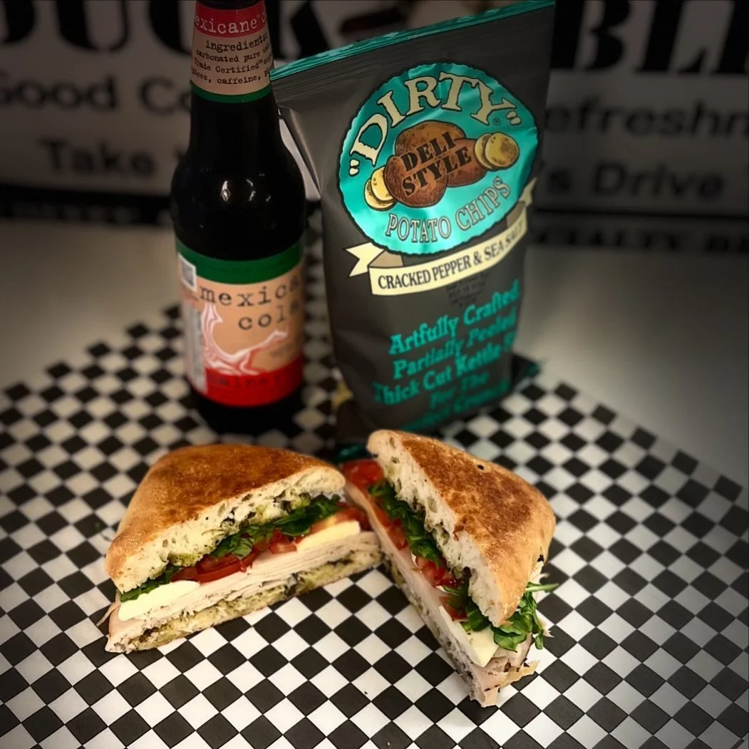 Handcrafted Boar's Head lunch sandwich with chips and a Maine Root soft drink from Duck Blind Drive-Thru in Rockport.