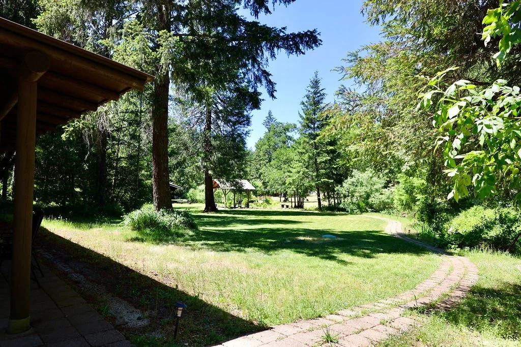 Serene forest lawn with winding stone pathway