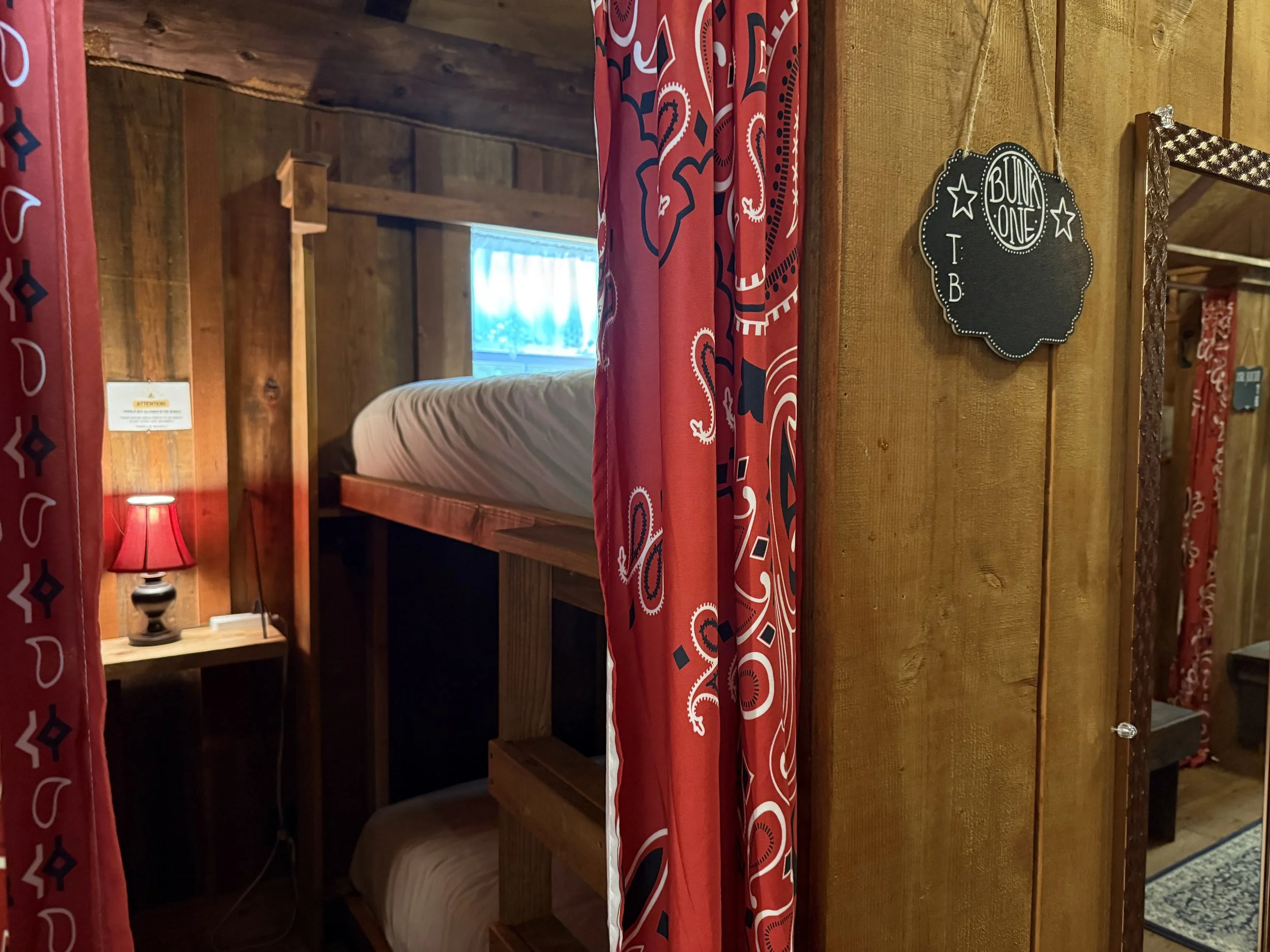 Bunk-One-With-Red-Curtain-And-Lamp-Bunkhouse-6994.JPG