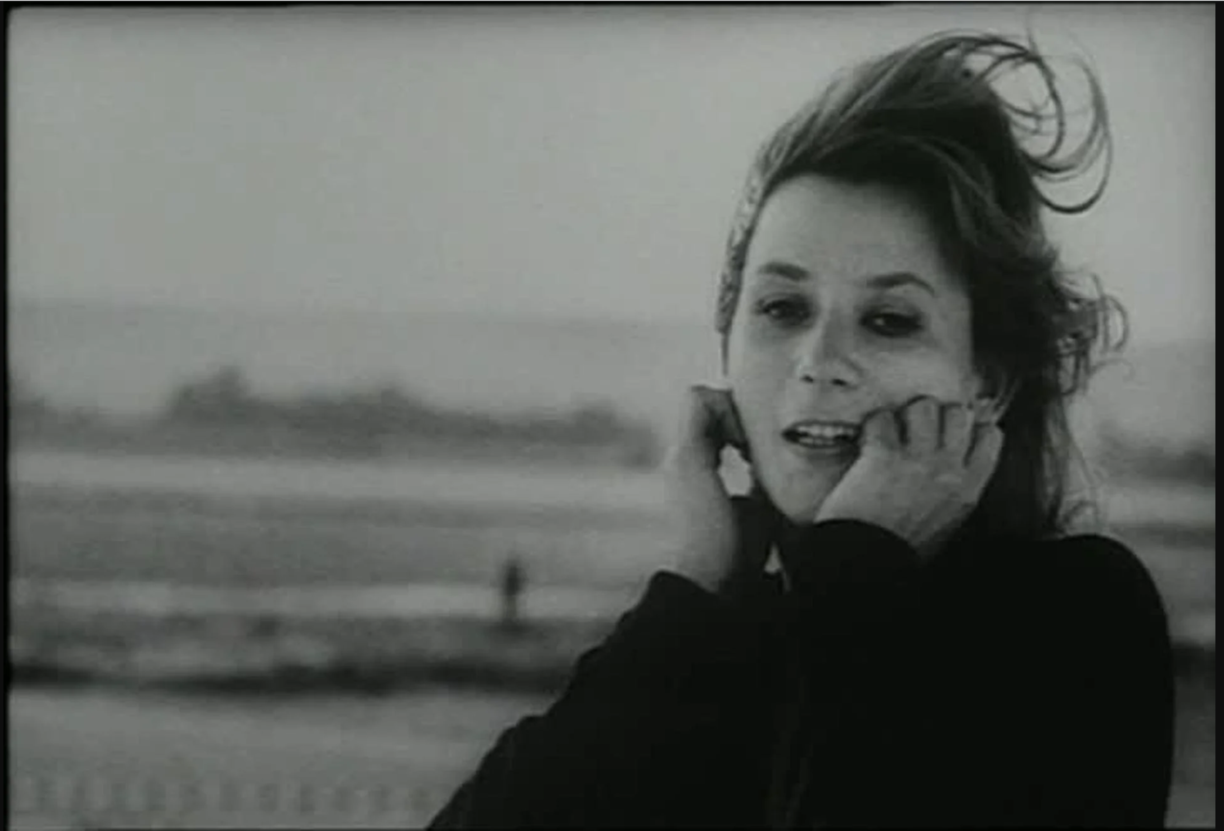  1 Marker, Chris, director.  La Jetée . Argos Films, 1964. Black and white photograph of a young woman with blonde hair in a black turtleneck at the shore. 