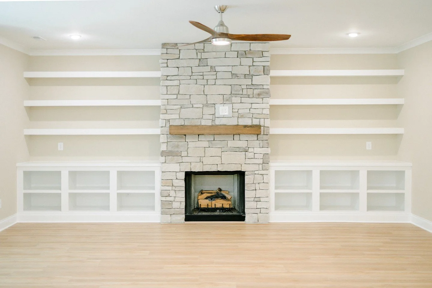 This fireplace is begging for a fire, and these built-ins are begging for your trinkets &amp; treasures. 🔥 

Cozy comes standard in a new construction MDB home like this. What would you fill these shelves with? 👀

Every #MassengillMade home is desi