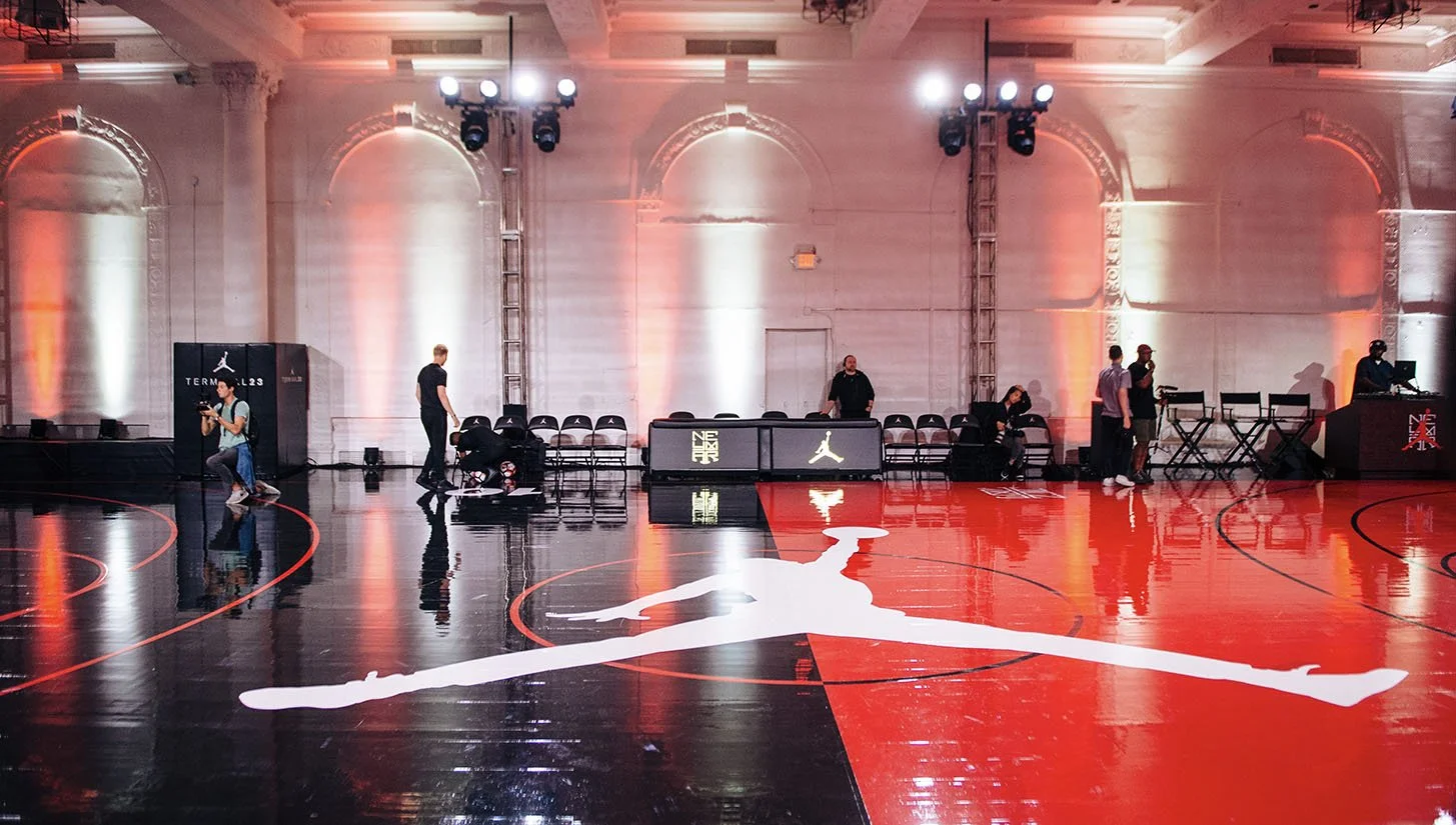 Jordan team gets a basketball court ready for a Jordan limited-edition pop-up.
