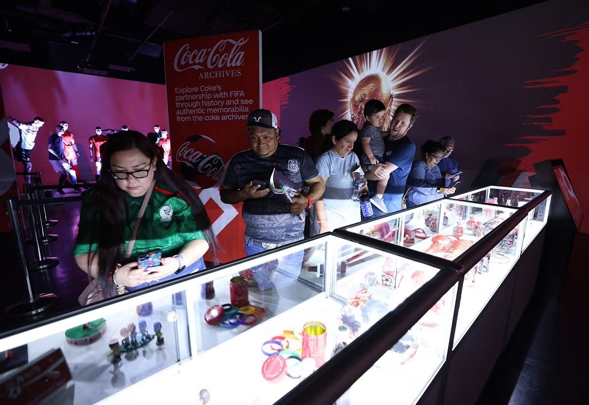 Fans touring the Coca-Cola FIFA Trophy Tour showcase.