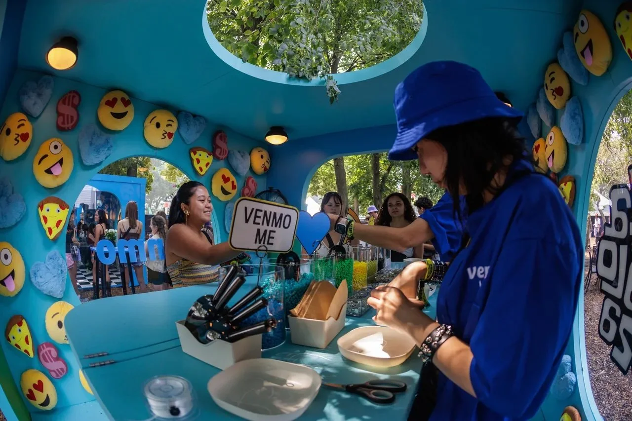 Festival goers at Venmo's charm bracelet bar 2025