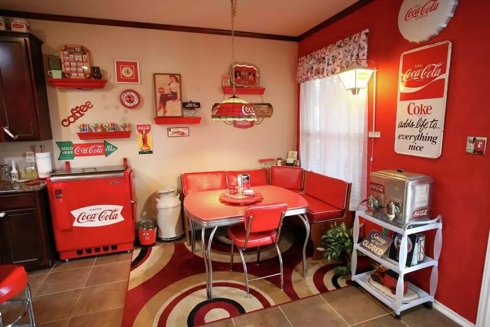 Dining room fully decked out in Coca-Cola decor.