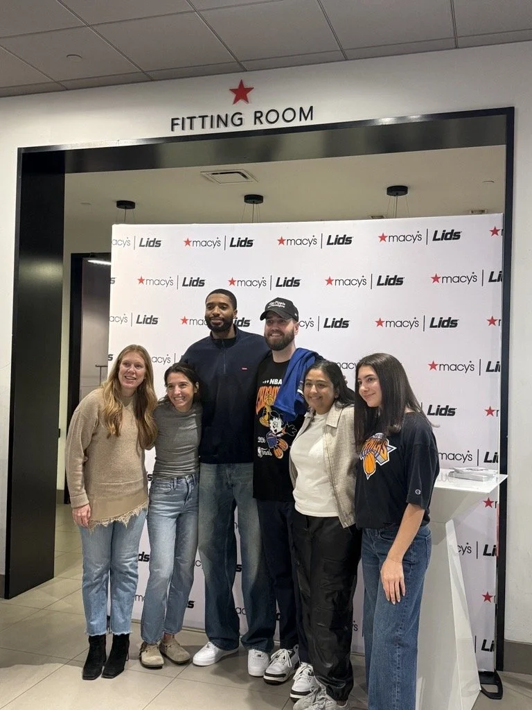 People gathered at Macy's and Lids with Mikal Bridges