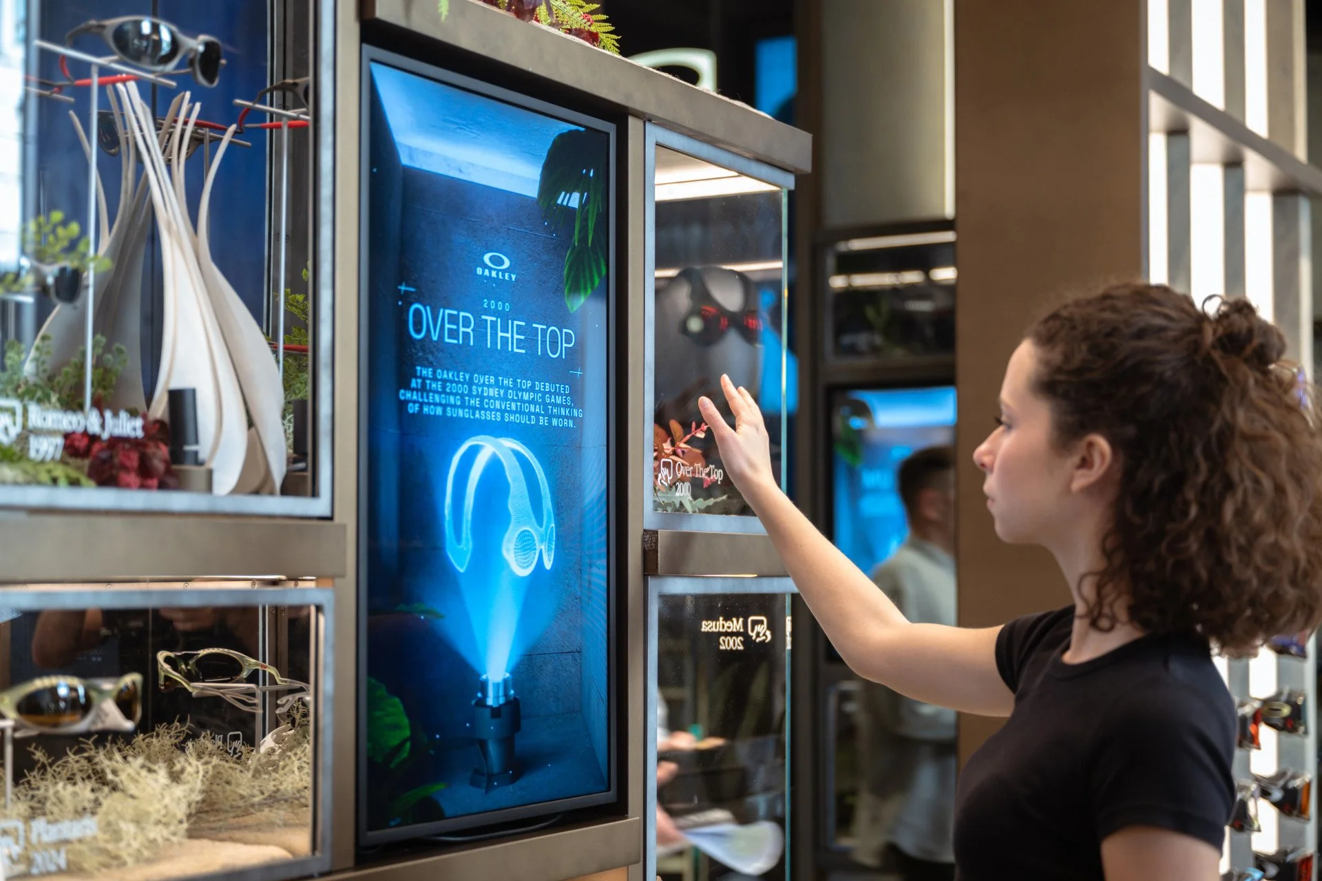 Costumer uses the Oakley mixed reality screen at their Experience Store