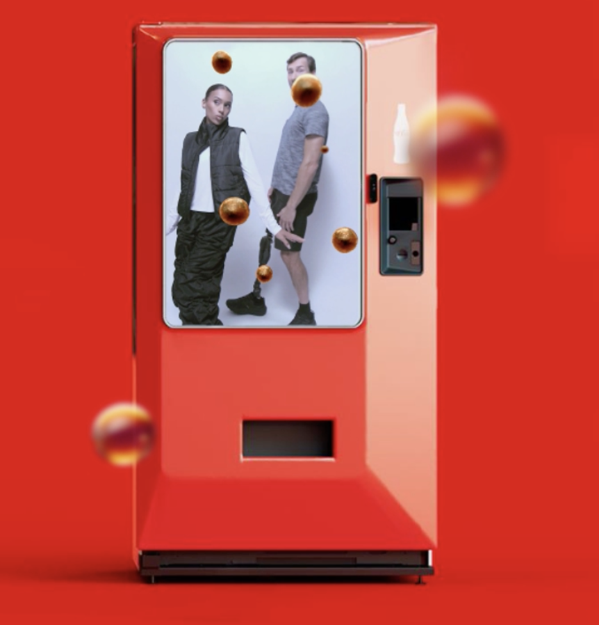 Customers pose at the Coca Cola AR Vending Machine