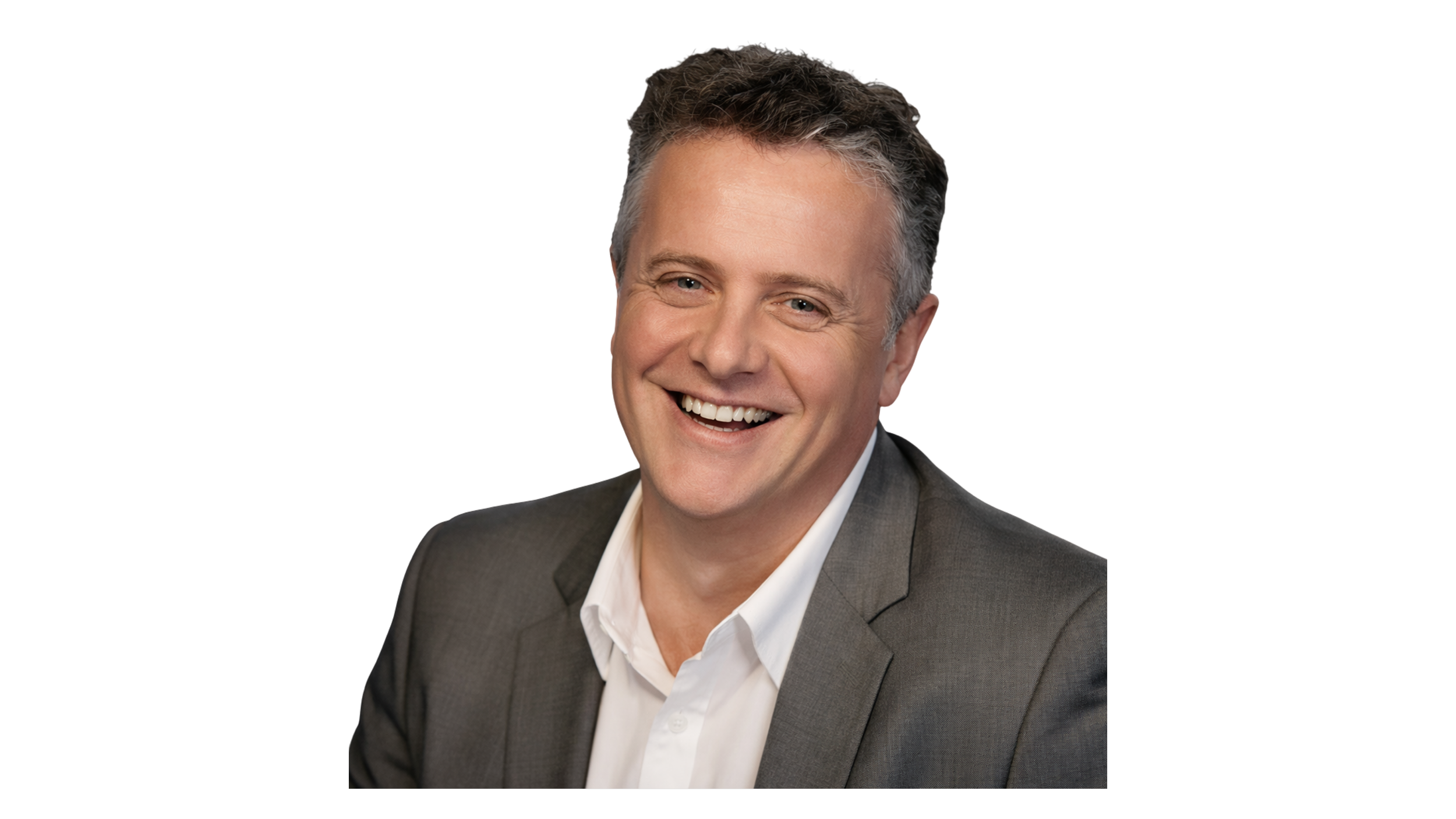 A smiling man in a gray suit with a white shirt, with dark, slightly curly hair and light skin. Frank Meehan