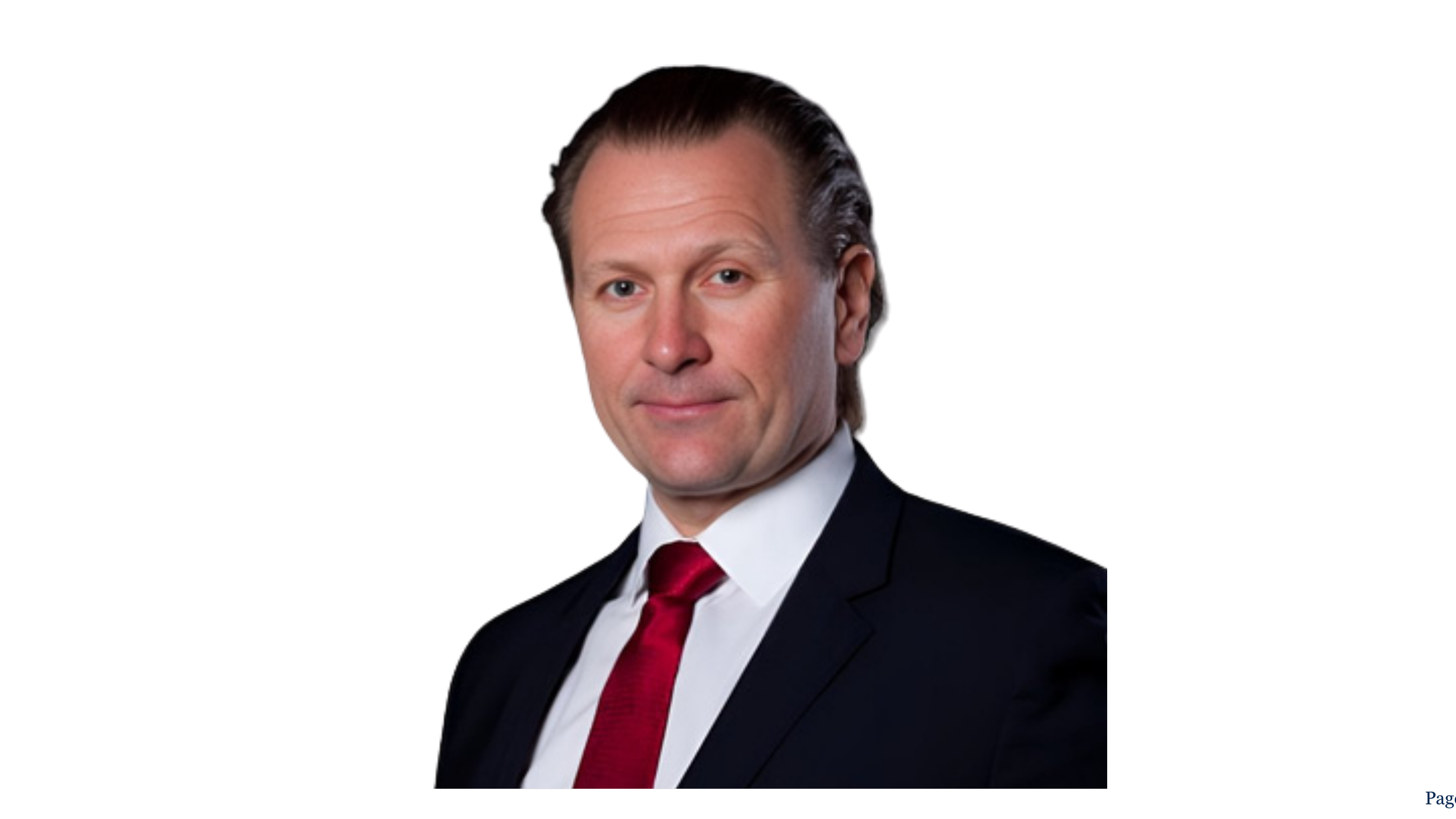 A headshot of a middle-aged man with light skin, brown hair slicked back, wearing a black suit, white shirt, and red tie, against a black background. Tor Langoy