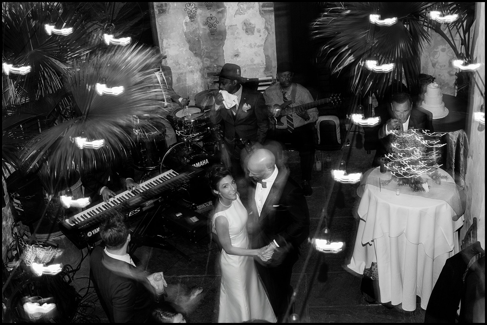 bride and groom dancing in court yard