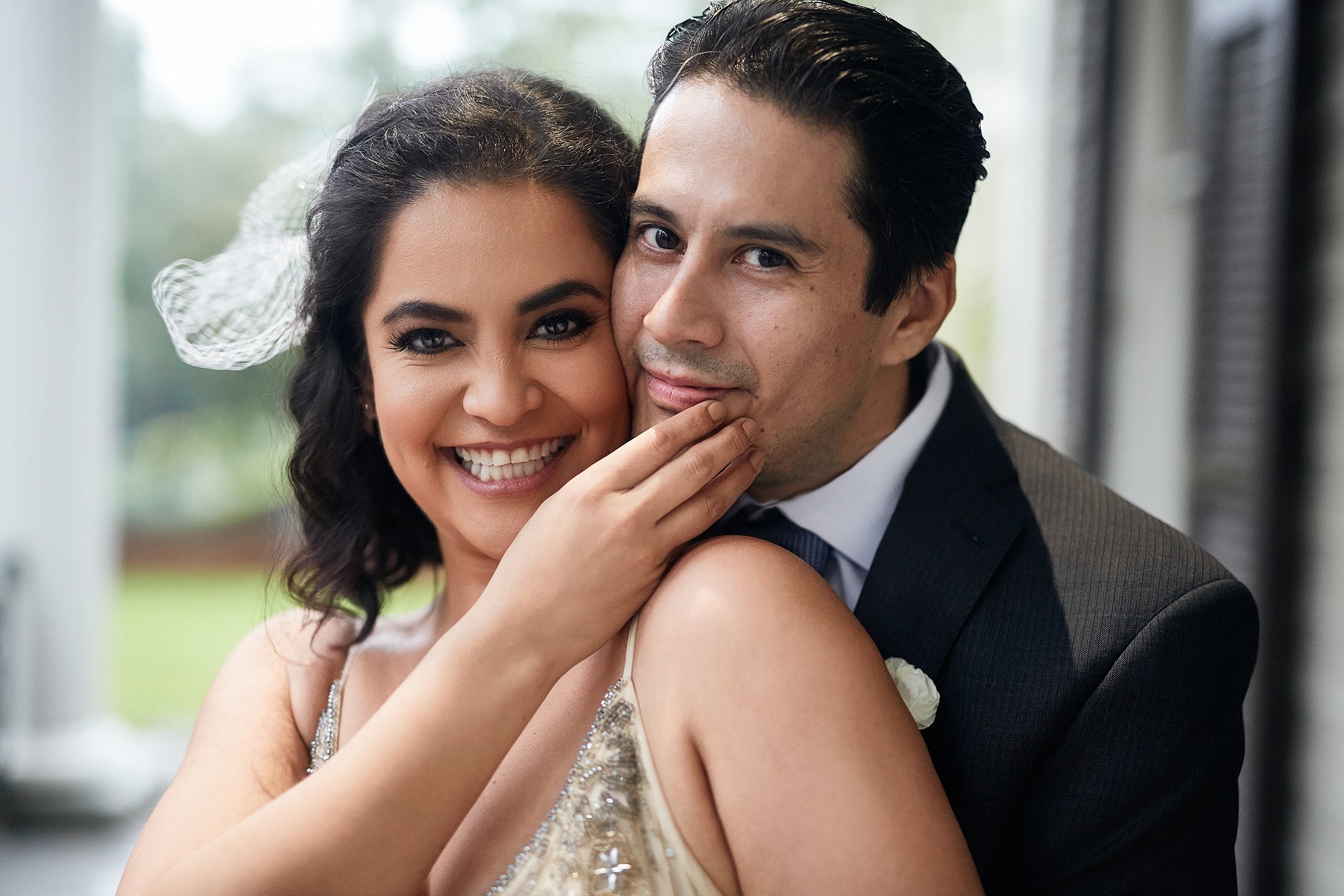 bride and groom smiling for a photo