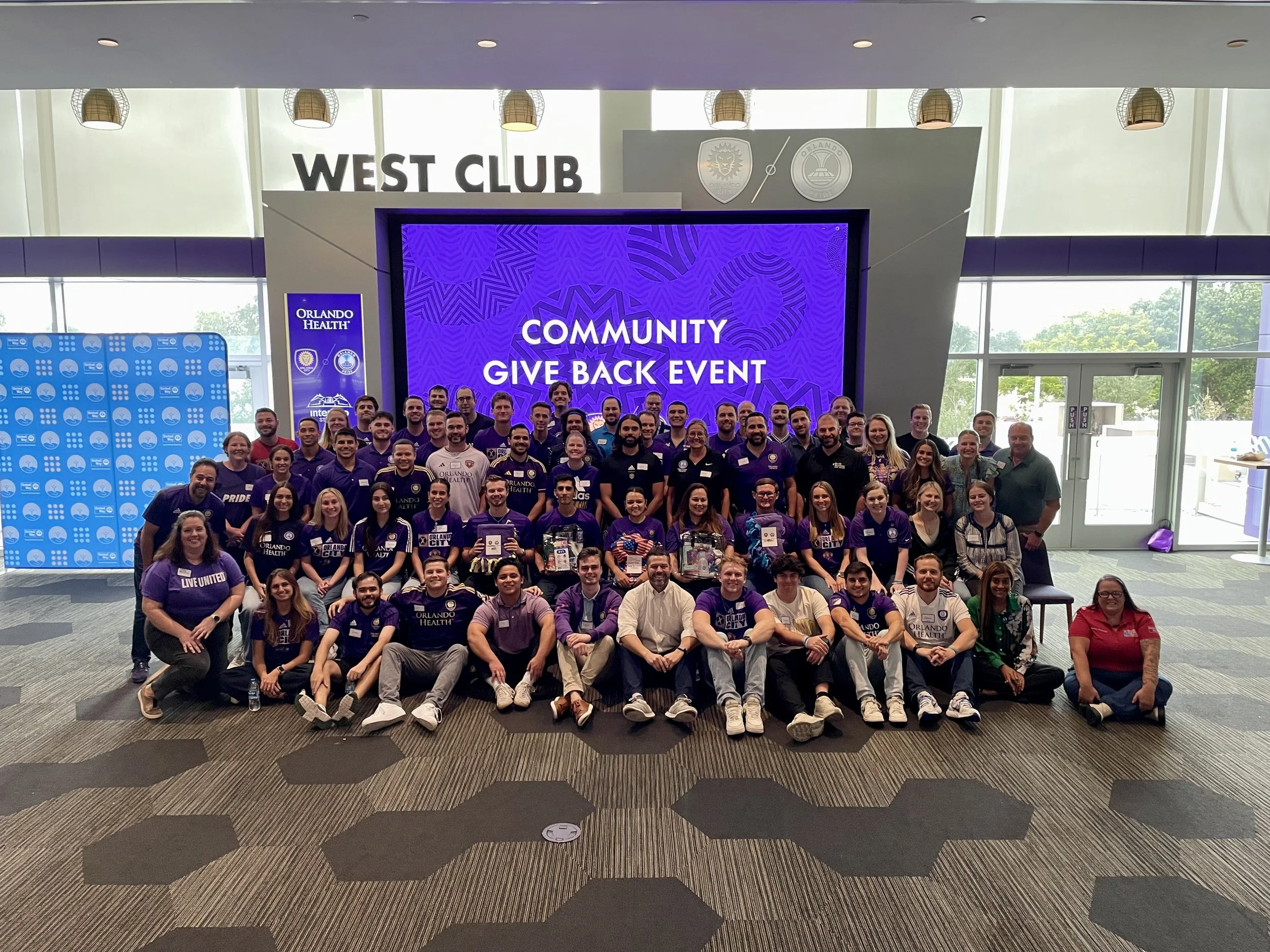 a group of volunteers gathered for a picture on the Community Giveback Day