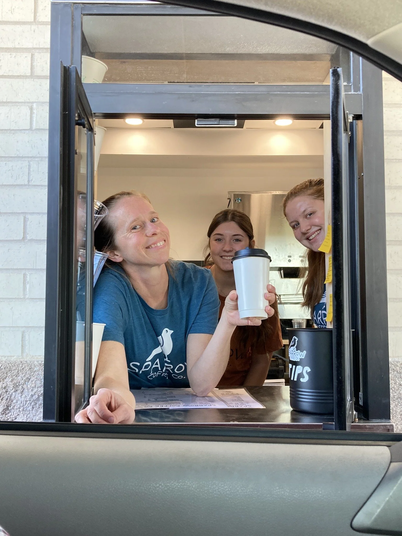 The friendly Sparrow Coffee team at Hunter's Ridge ready to serve your order at the window.