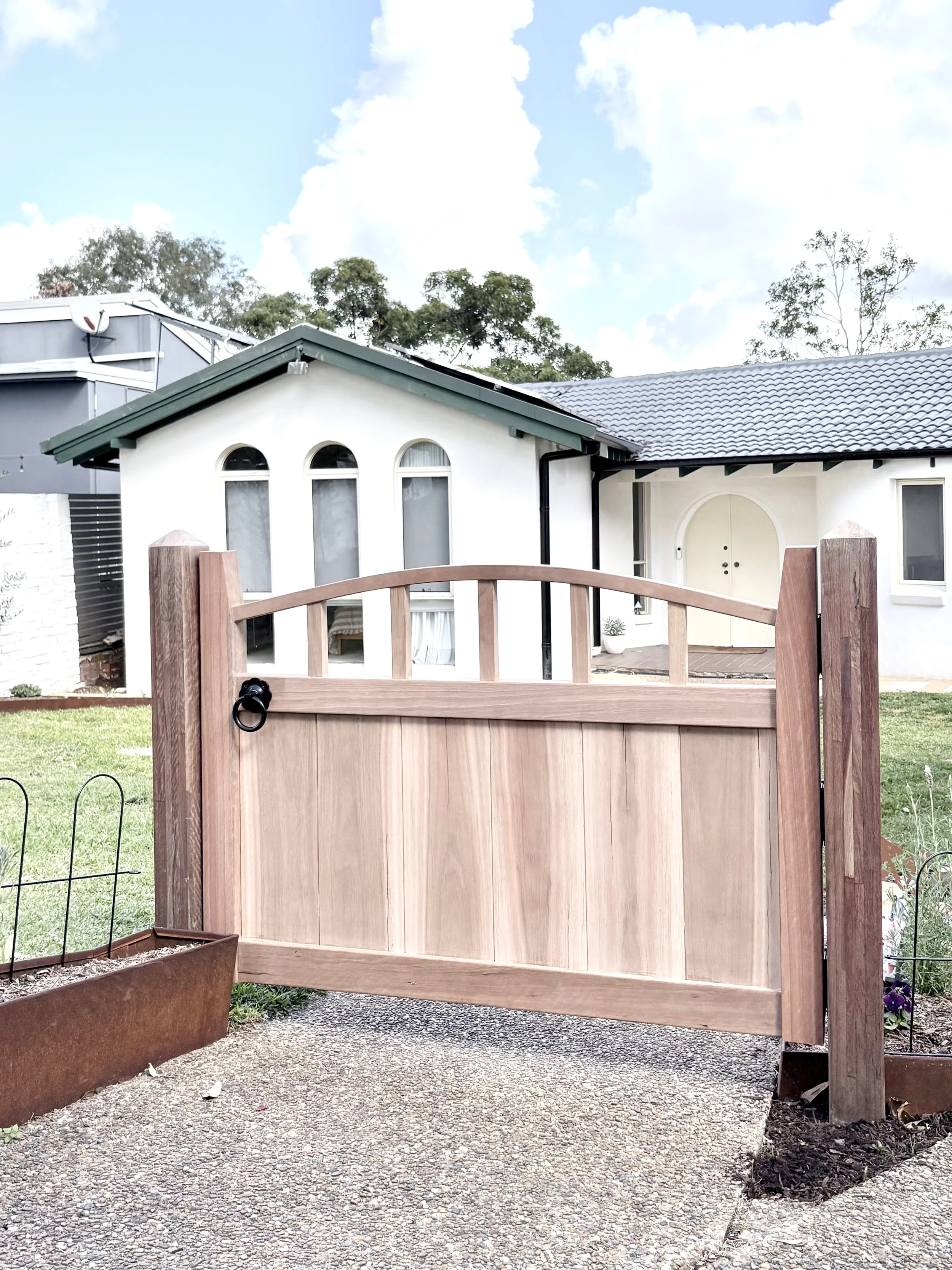 Spotted gum gate - pure traditional joinery and steam bending, achieving an arch made from a solid piece of hardwood.