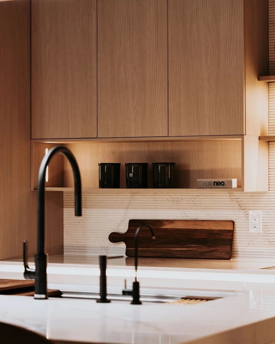 Less clutter. More clarity. 🌿
A thoughtfully designed kitchen by Nolte Neo pairs warm textures and modern cabinetry with lift-up storage designed to keep the space clean, functional, and visually uninterrupted.

#herbandoak #luxuryinteriors #designs