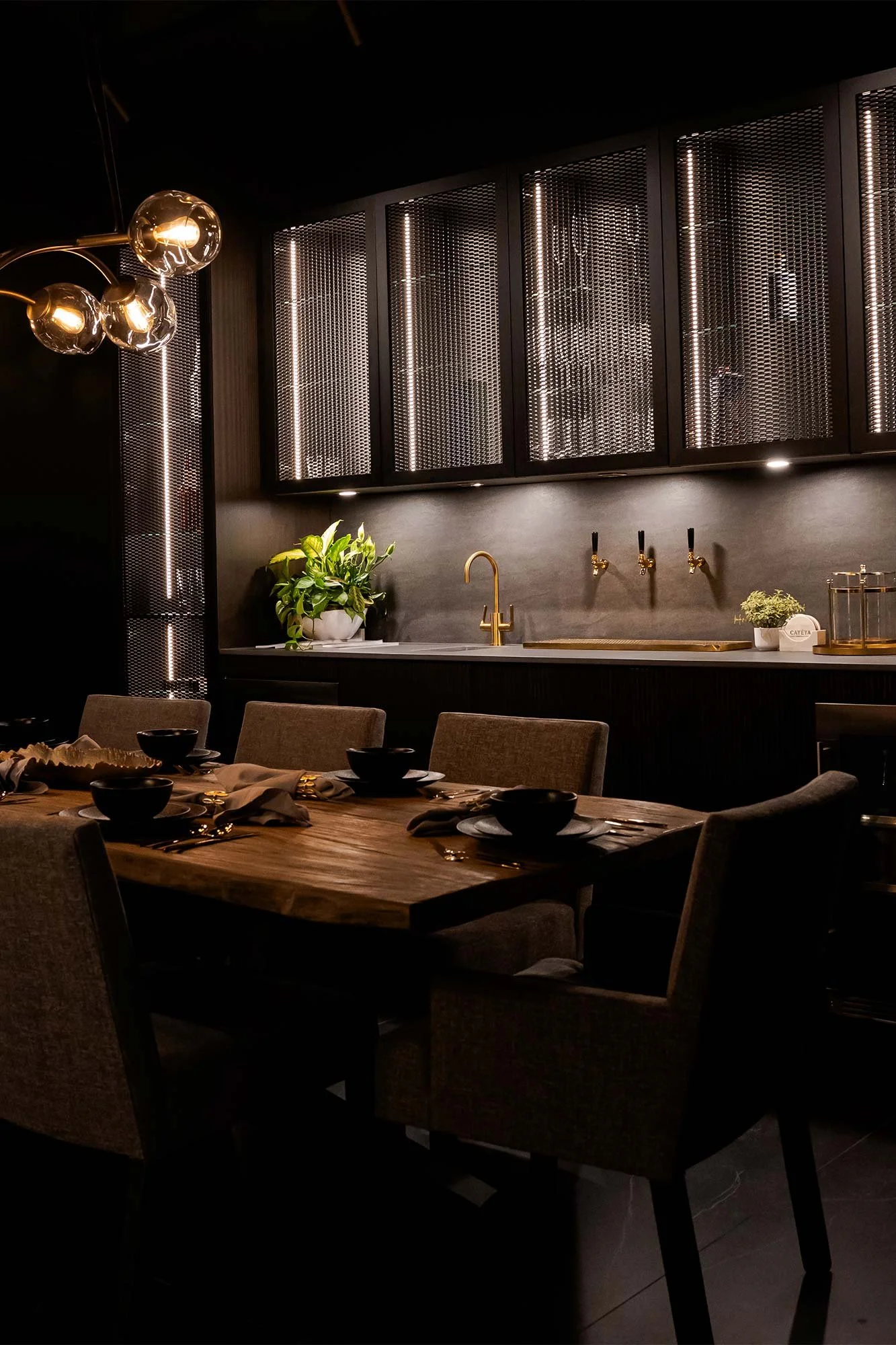 For those who appreciate quiet detail.
A moody, refined lounge pairs rich materials and warm lighting with integrated glass storage, allowing function to support the space without competing with it.