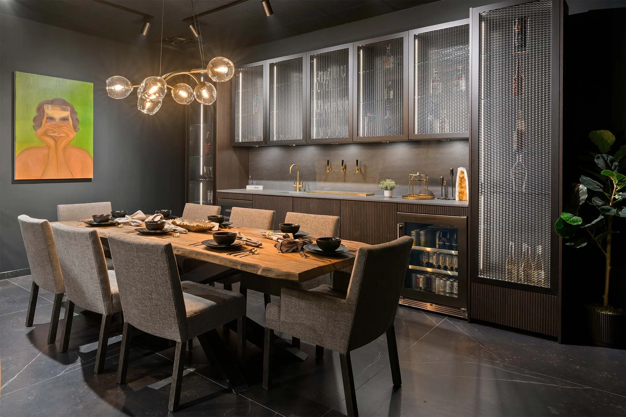 Nolte Neo cabinets feature Neo Lodge bar and cabinet fronts with NEOGRID. Simon Pearce light fixture. Chairs by Bernhardt. Custom table created by Herb+Oak. 