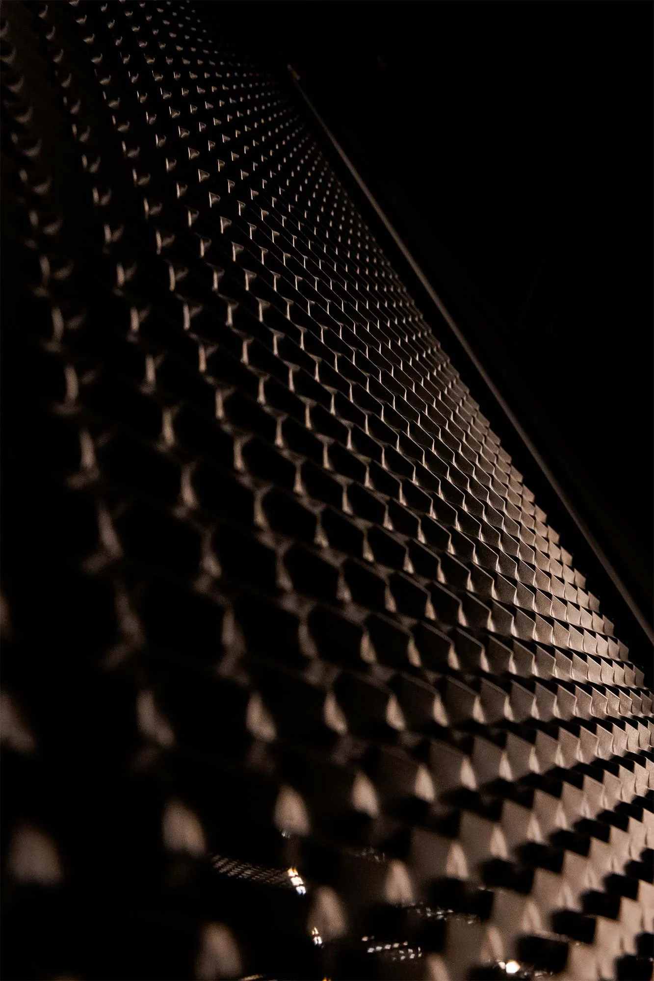 Nolte Küchen neoGRID is a specialized design element within the Nolte Neo line, featuring black expanded metal in an aluminum frame. 