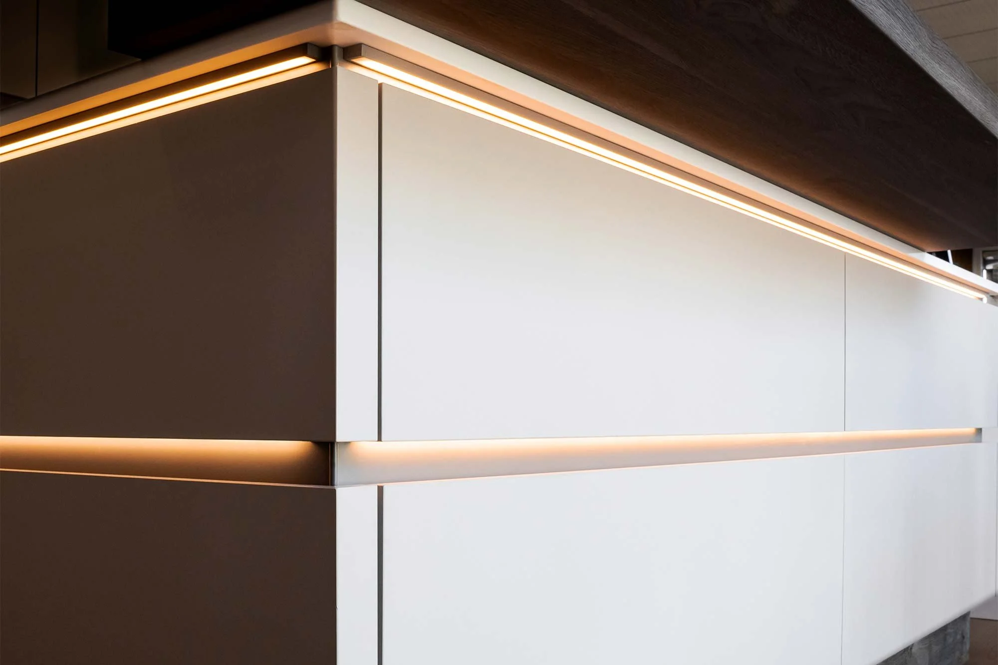 Modern Luxury Kitchen With Seamless, Handleless Cabinetry And Integrated Lighting Kitchen Remodel by Herb and Oak Design Studio project photo 3