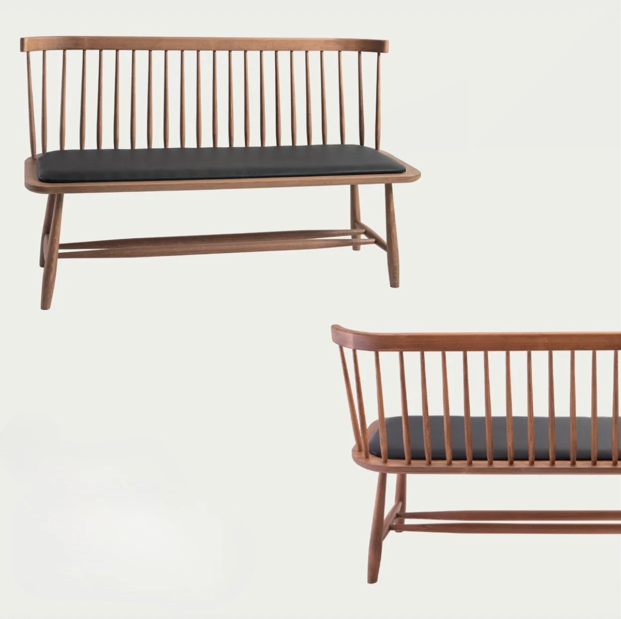 Artisan NOMO walnut bench with luxury black upholstery and steam-bent wood frame for high-end living spaces; by Nuovo Kitchens Vancouver.