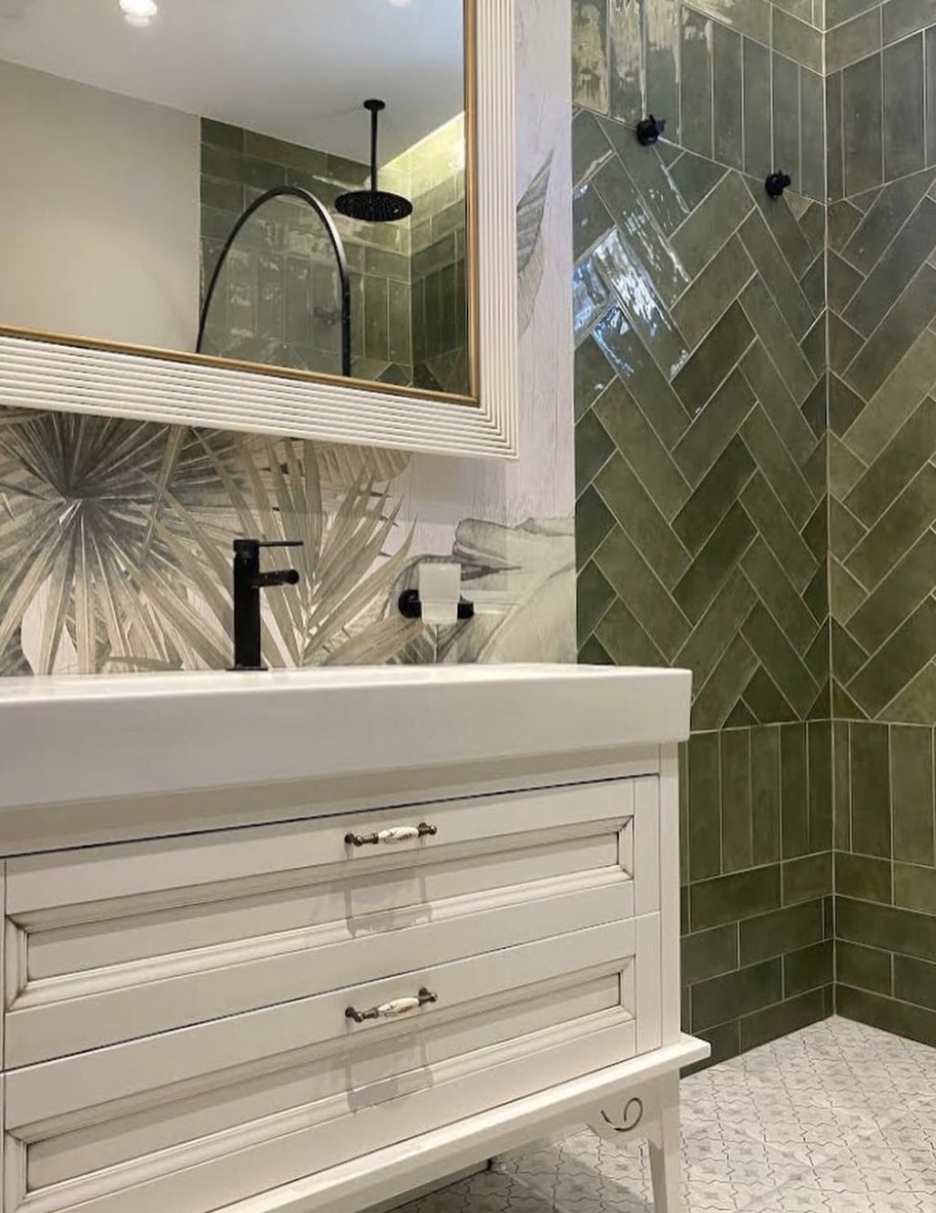 Elegant bathroom with green mediterranean tiles and tropical leaves design wallpaper