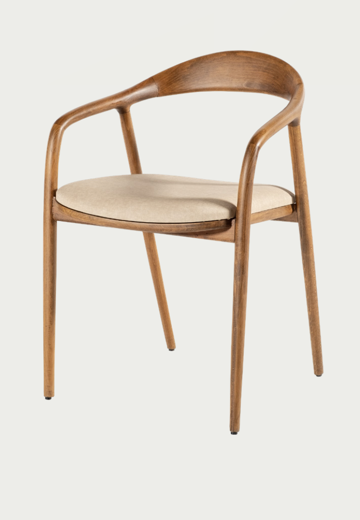 Artisan NOMO oak dining chair with luxury cream upholstery and steam-bent wood frame for high-end dining rooms by Nuovo Kitchens Vancouver.