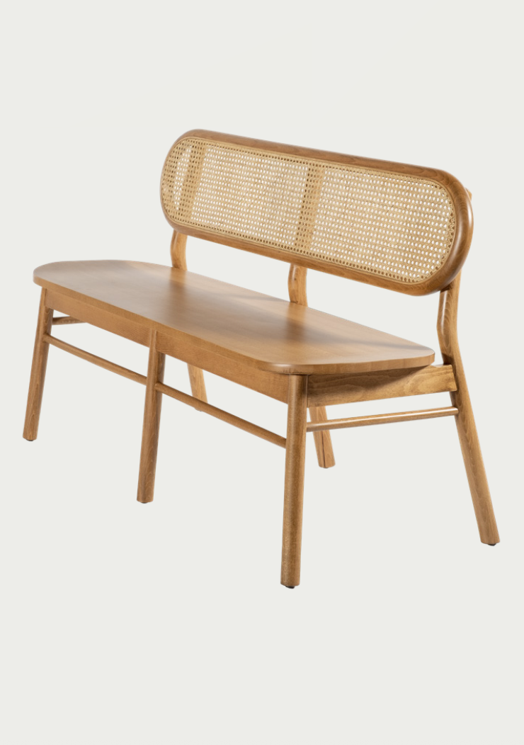 NOMO handmade wooden bench and matching chairs with woven Hazeran backrests in a sunlit modern interior, imported by Nuovo Vancouver.