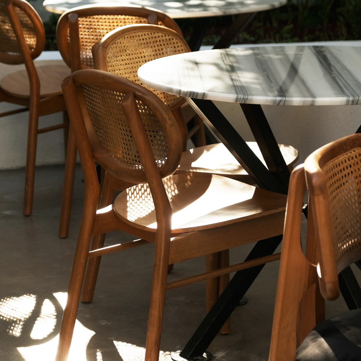 NOMO handmade black wooden dining chairs with curved backrests styled in a modern Nuovo kitchen interior, Vancouver.