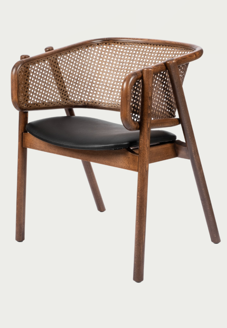 Luxury NOMO oak dining chair with natural Hazeran cane backrest and armreast, steam-bent wood frame for high-end dining rooms by Nuovo Kitchens Vancouver.