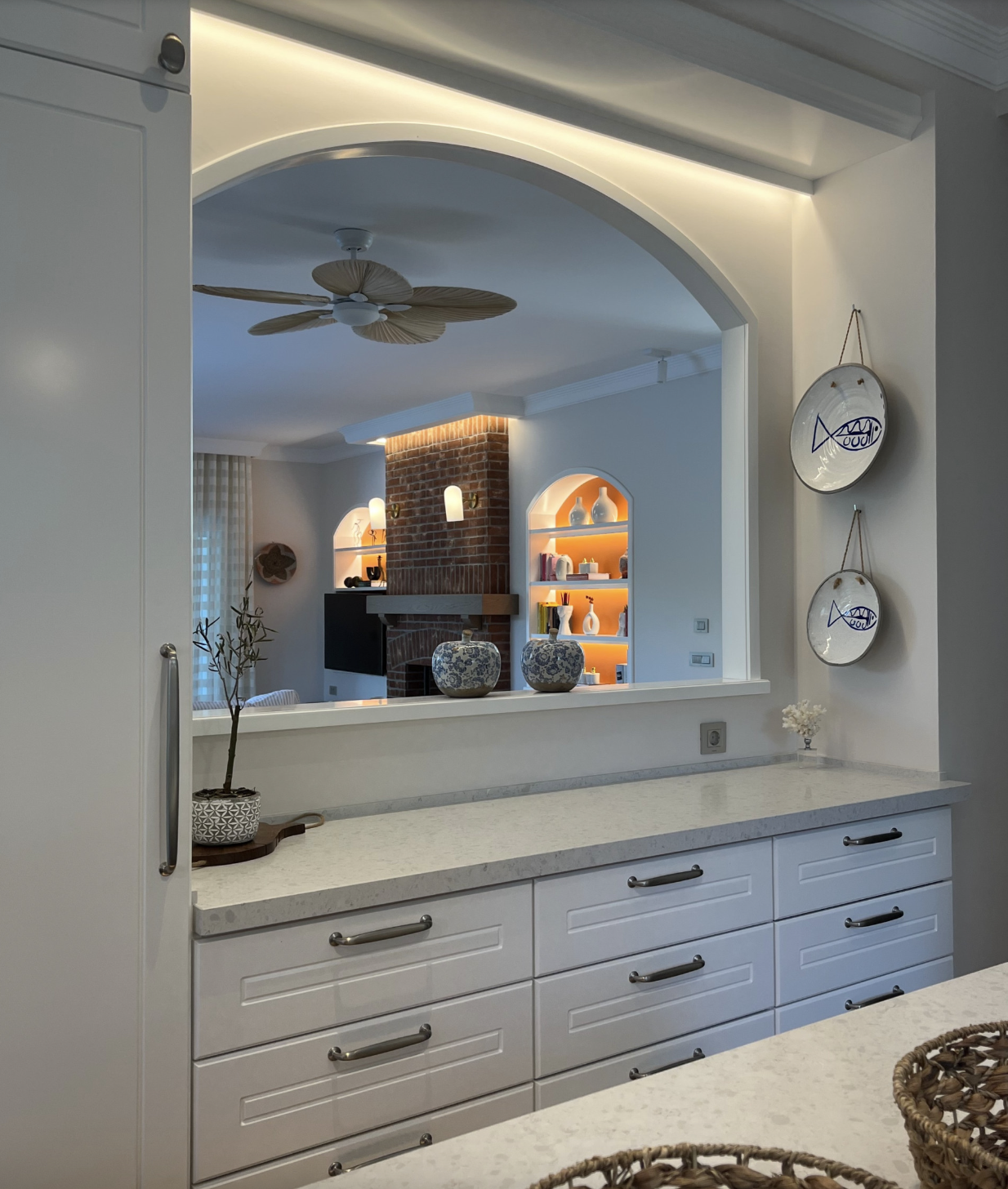 Open modern kitchen gallery view with custom cabinetry and design elements by NUOVO Kitchens Vancouver