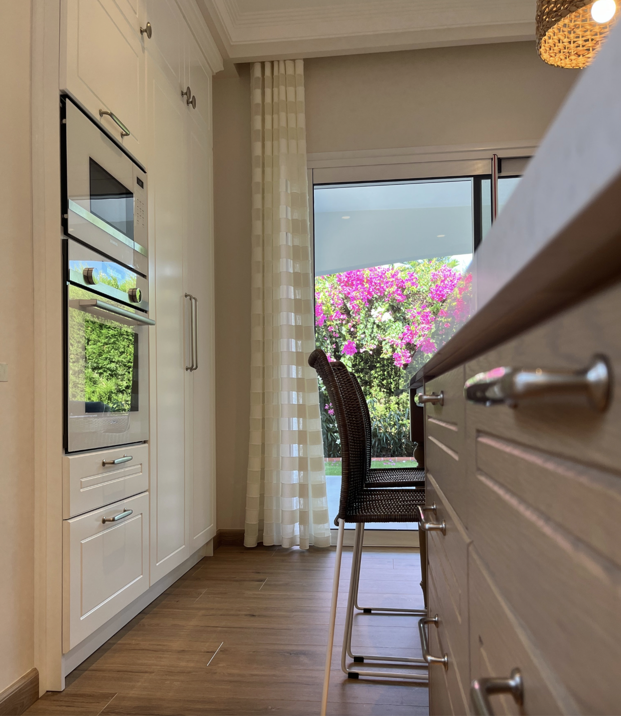 Contemporary kitchen interior showing custom cabinets and integrated lighting by NUOVO Kitchens Vancouver