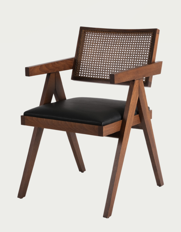 Luxury NOMO oak dining chair with natural Hazeran cane backrest and steam-bent wood frame for high-end dining rooms by Nuovo Kitchens Vancouver.