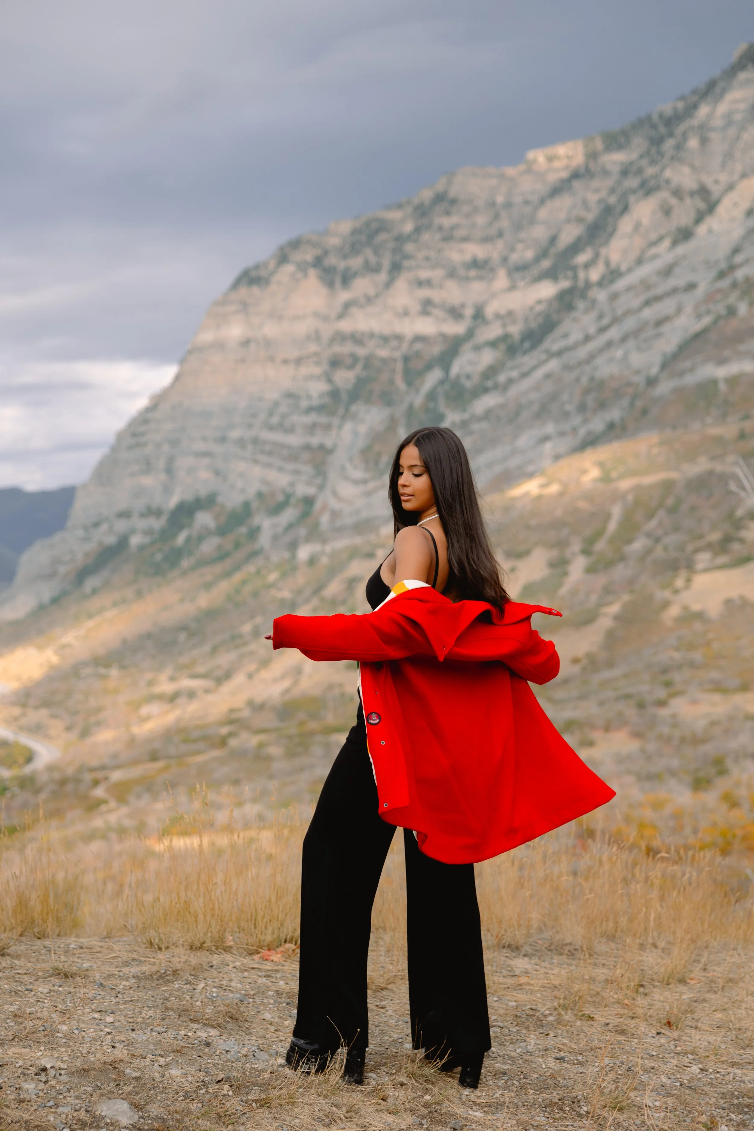 High-fashion photography at Kyhv Peak with sweeping views of Provo Canyon and warm, golden mountain light.