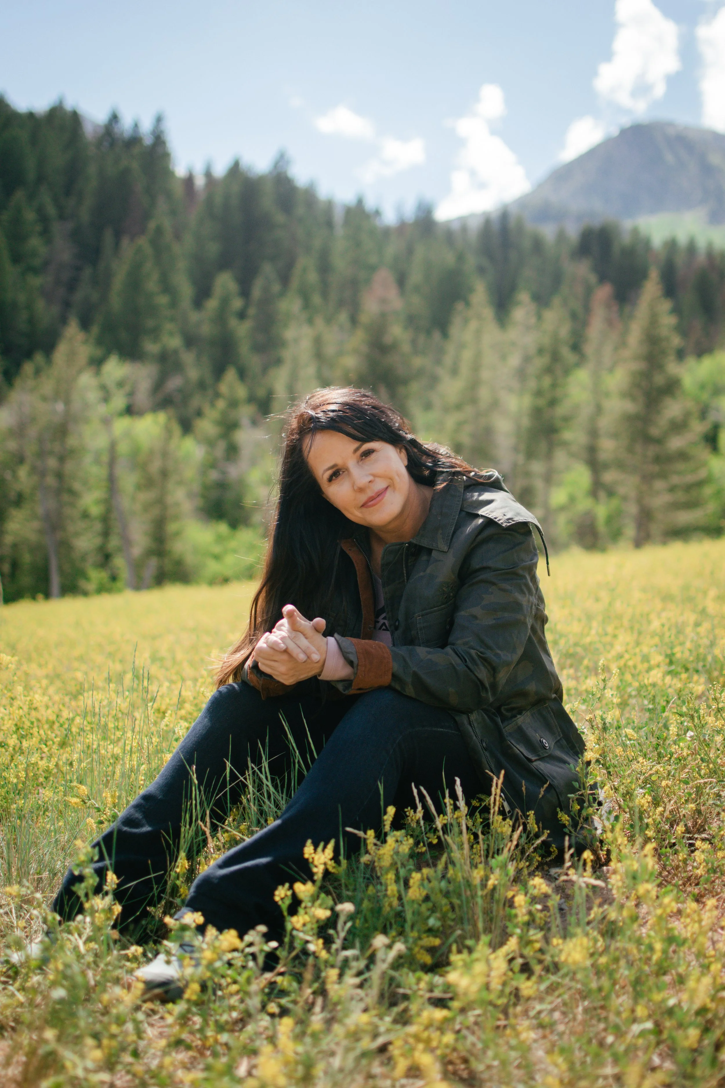  Portrait on Tibble Fork lake, surrounded by snowy pine trees and alpine mountain views 
