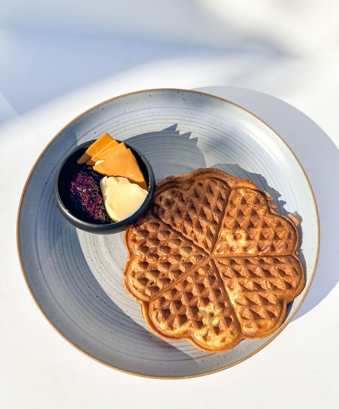 The Cardamom Waffle is BACK on the menu!! 🧇

Served with lingonberry jam, butter and Norwegian brown cheese 🇳🇴 the perfect bite is REAL 🤌