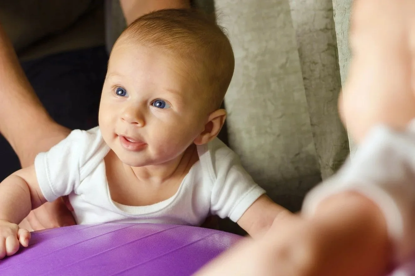bigstock-Man-Is-Holding-Baby-On-Gymnast-115762622.jpg