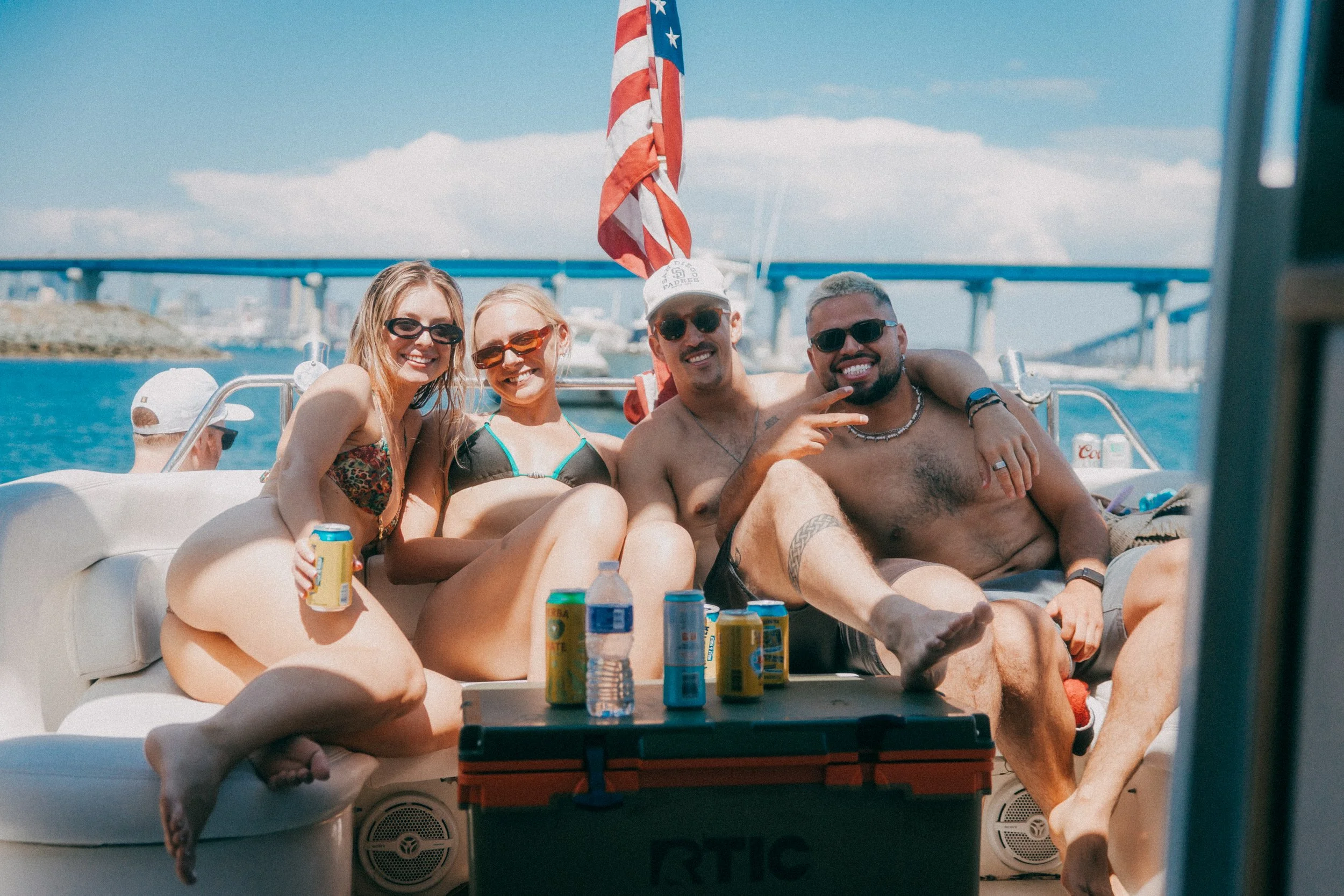 Guests Enjoying a pontoon boat under the Coronado Bridge in San Diego