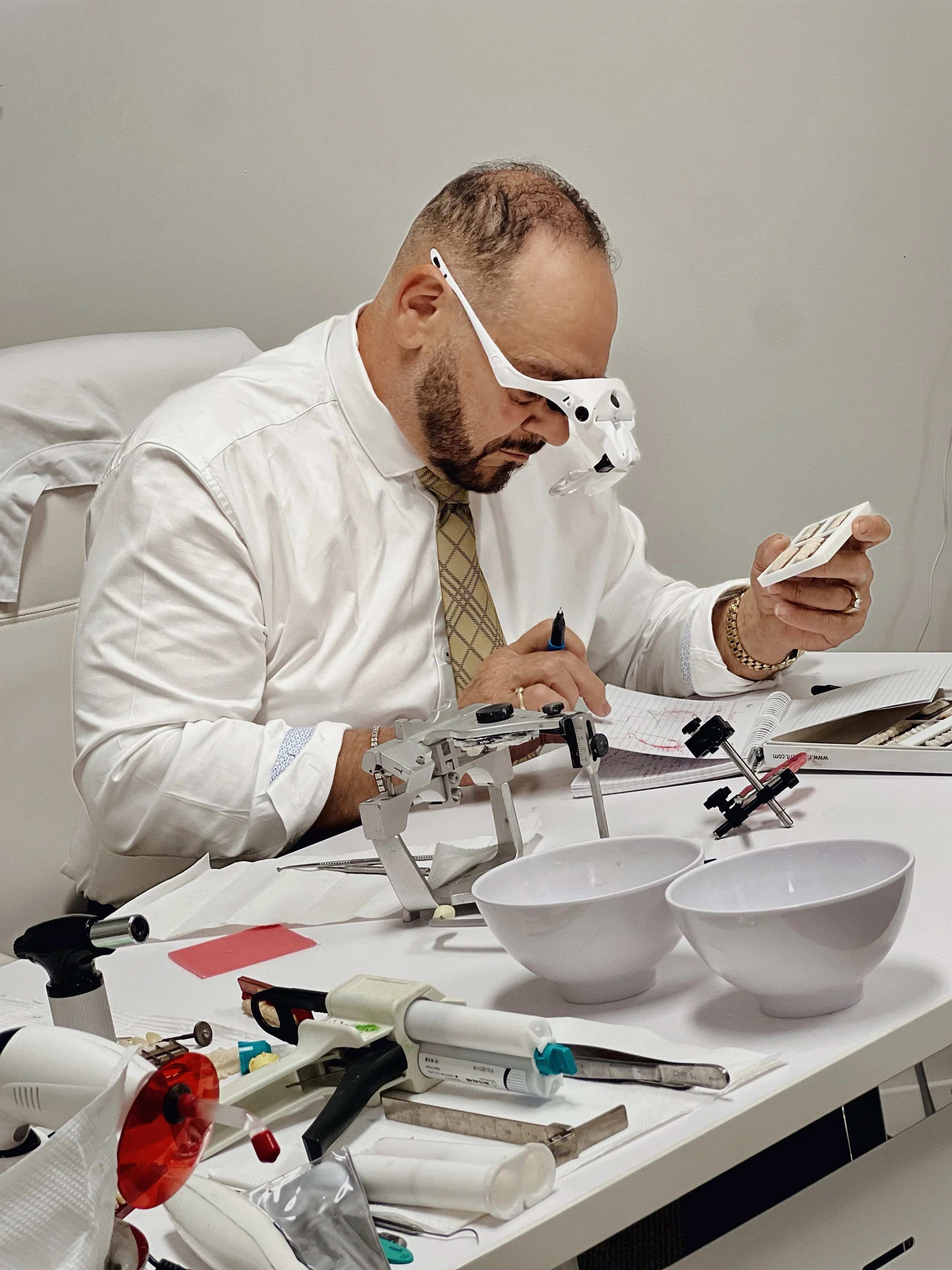 Custom denture fabrication Melbourne.
Dental prosthetist Melbourne, denture boutique Preston.

This image reinforces the technical authority of Dr. Sebastian Riggio. By showing the laboratory process, it highlights the boutique's capability to manage
