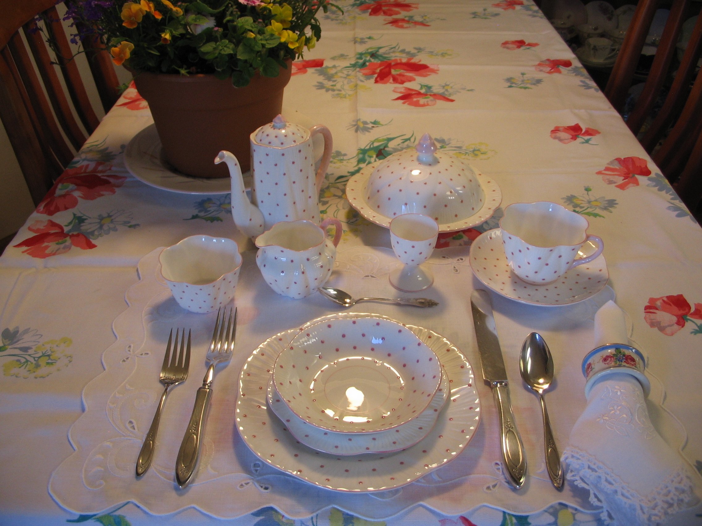 Shelley Coral Polka Dots Pattern #13748/D; floral napkin ring Pattern #12964; 4 1/2" sterling teaspoon; Oneida Community Sterling flatware; placemats by "Hand Crafted Linens"; napkins hand embroidered from Ireland, tablecloth - Wilendur Floral