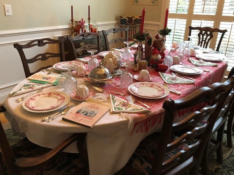 Christmas Tea: Shelley Dainty Pink #051/P, together with pre-Civil War inverted Fern pattern glass, Towel Old Colonial sterling flatware, handmade linen napkins, and Scandinavian Tomte Santas.