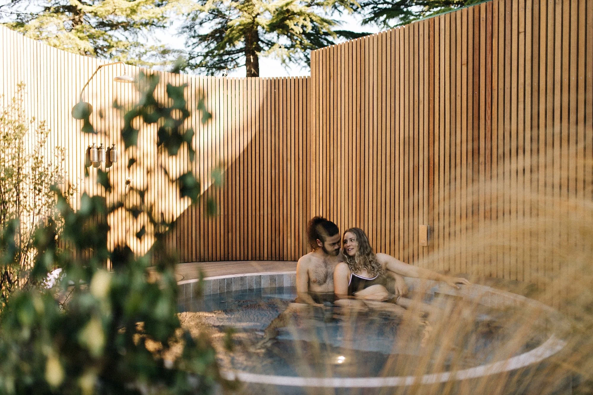 Bathers soaking in a Botanical view pool at Bathe in Queenstown.