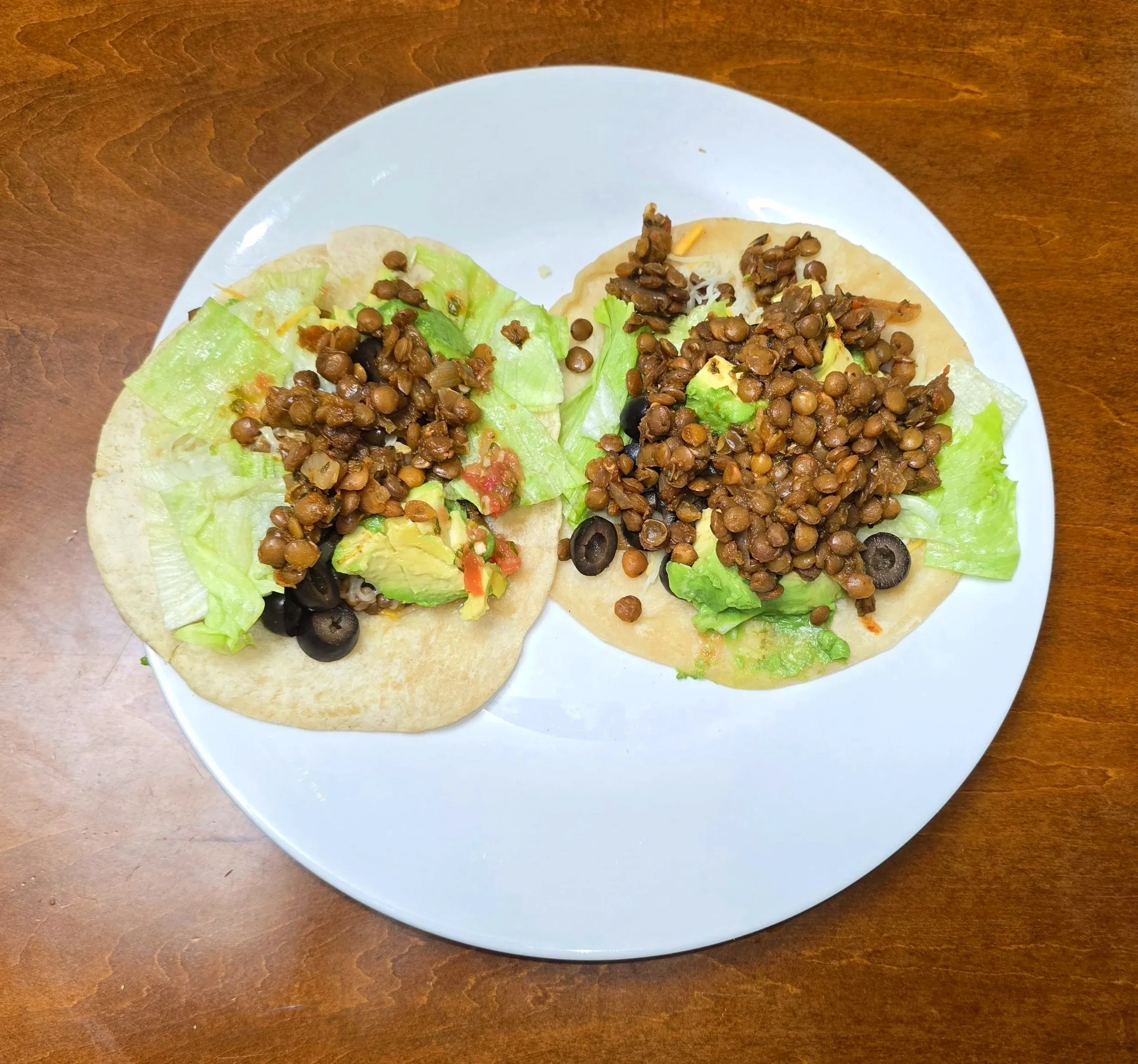 vegetarian lentil tacos made with slow cooker lentil filling and fresh taco toppings