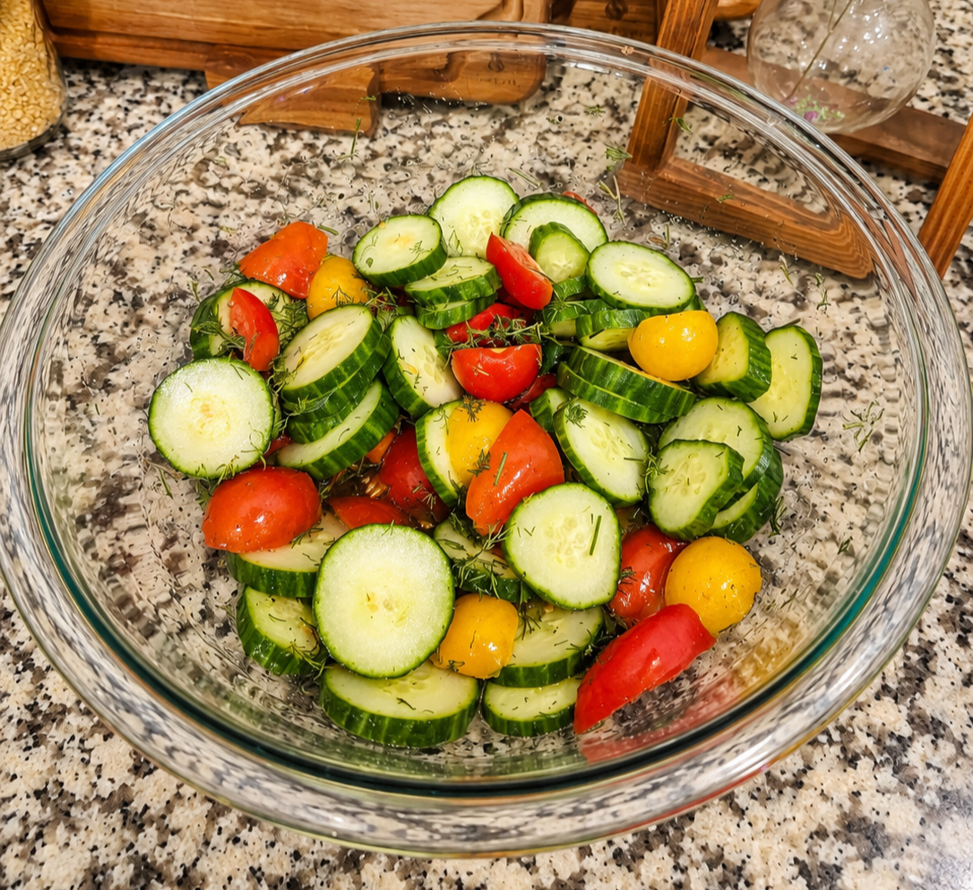Fresh cucumber and tomato salad with dill in a sweet vinegar dressing.