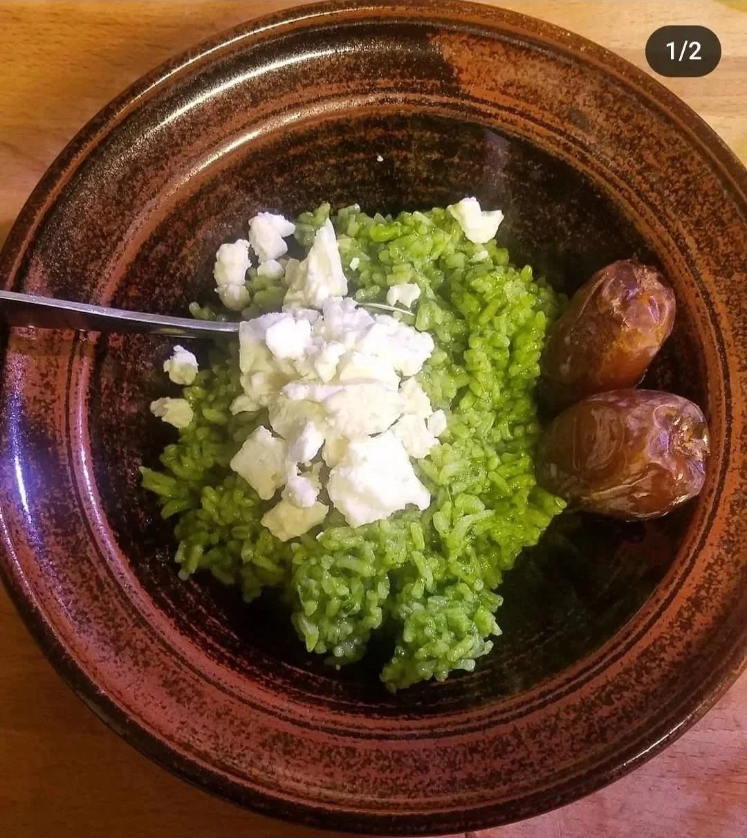 green rice made with spinach and peppers in a saucepan
