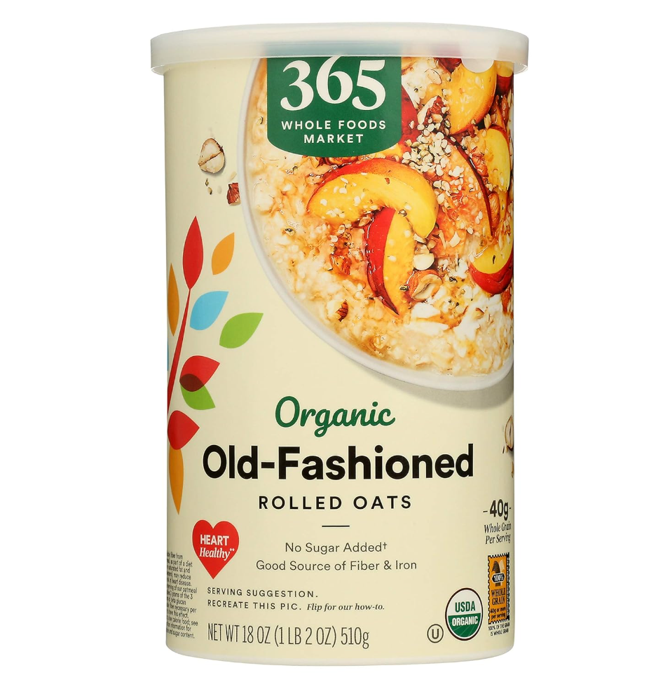 Container of 365 Whole Foods Market Organic Old-Fashioned Rolled Oats with a picture of oatmeal topped with fruit on the label.