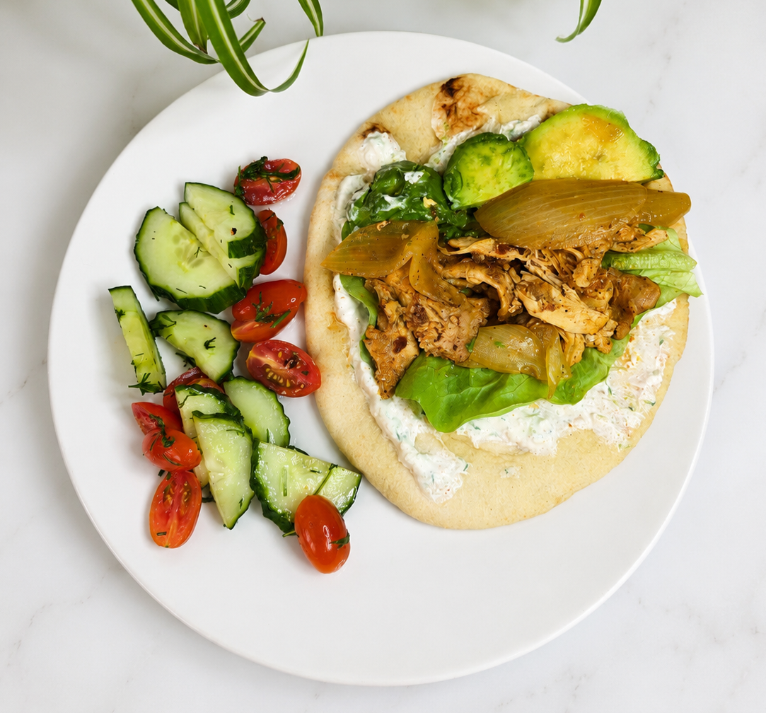 Tender slow cooker chicken shawarma made with a Greek yogurt and olive oil marinade, warm Mediterranean spices, and a creamy cucumber yogurt sauce. Perfect for pita, grain bowls, or meal prep.