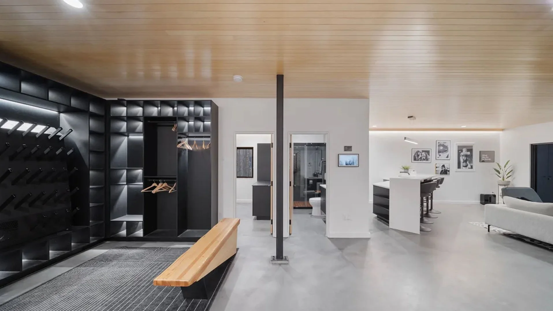 RAVN HAUS vacation rental Approach Studio with custom lit gear lockers, wood bench, and ski racks on Mt. Hood, Oregon.