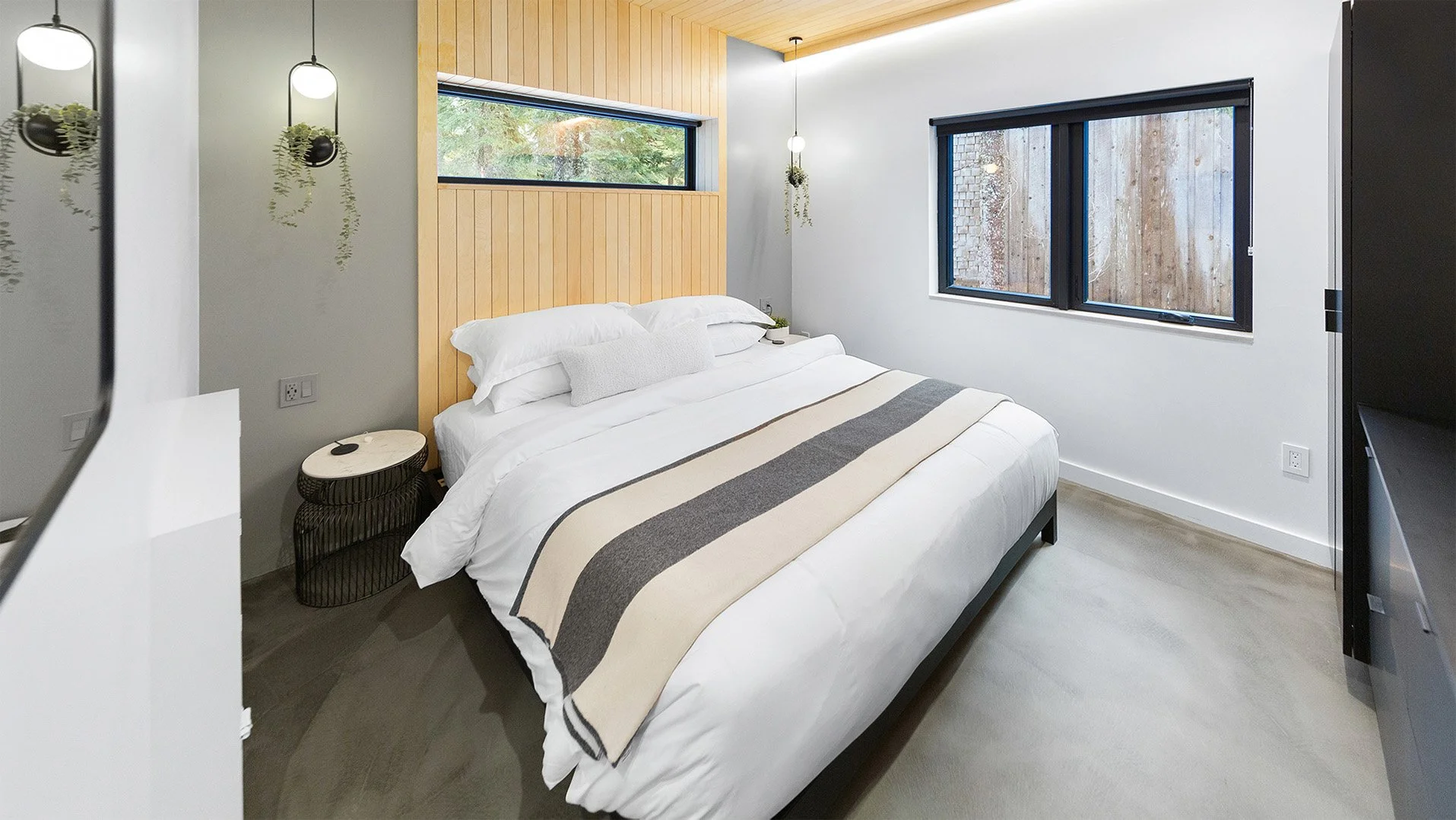 RAVN HAUS vacation rental Cascade King Room with platform king bed, wood slat wall, and heated floors on Mt. Hood, Oregon.