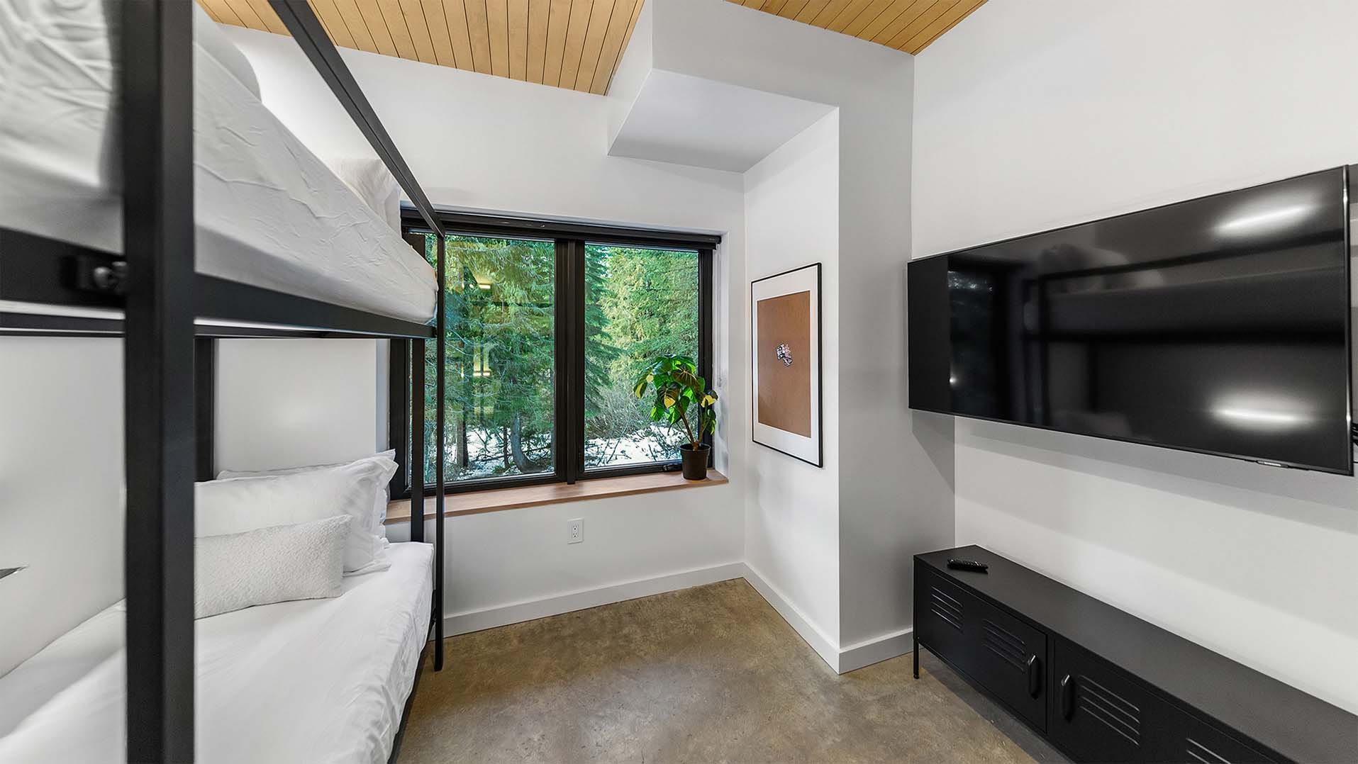 RAVN HAUS vacation rental Elevate Bunk Room south wing with custom bunks, flat screen TV, and toy station on Mt. Hood, Oregon.